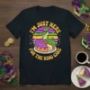 I'm Just Here For The King Cake Mardi Gras t-shirt with a cartoon alligator on a king cake