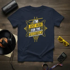 Navy t-shirt with yellow and white text that reads "I'M JUST HERE FOR THE VIBRATIONS" in a stylized font, surrounded