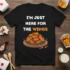 I'm Just Here For The Wings text with illustration of chicken wings on a black t-shirt