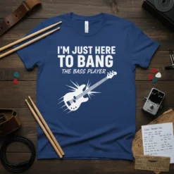 I'm Just Here To Bang The Bass Player T-Shirt design with white text and a white electric bass guitar graphic