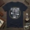 Funny t-shirt with the quote "I'm Just Here To Establish An Alibi" and detective office graphics