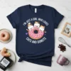 I'm Just A Girl Who Loves Cats And Donuts text on a navy t-shirt with three cute cats on a