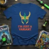 Blue t-shirt with yellow Loki helmet graphic and orange text "I'M JUST A VARIANT"
