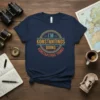 Retro circular design with text "I'M KONSTANTINOS DOING KONSTAATINOS THINGS" on a navy blue t-shirt