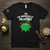 I'm Magically Delicious text with a green cauldron and bubbling potion on a black t-shirt, St. Patrick's Day theme