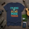 T-shirt with "I'M MIKE DOING MIKE THINGS" text and a graphic of a man walking, surrounded by shoes and a