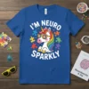 I'm Neuro Sparkly text with a cartoon unicorn wearing sunglasses and puzzle pieces on a blue t-shirt