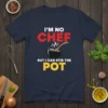 I'm No Chef But I Can Stir The Pot text design with a cooking pot graphic and wooden spoon