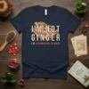 T-shirt with text "I'm Not Ginger I'm Strawberry Blonde" featuring stylized strawberry blonde hair and floral accents