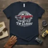 I'm Not Old I'm Classic text with a vintage red muscle car graphic on a navy blue t-shirt