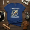 T-shirt with white text "I'm Not Old I'm A Classic" and a yellow rocket graphic surrounded by vinyl records