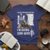 I'm Not Procrastinating I'm Doing Side Quests text with gamer graphic on a navy blue t-shirt