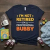 I'm Not Retired I'm A Professional Bubby quote t-shirt in navy with yellow and orange text