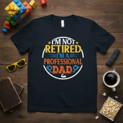 T-shirt with the text "I'm Not Retired I'm A Professional Dad" in a circular design with tools and a bicep