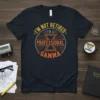 I'm Not Retired I'm A Professional Gamma t-shirt with circular design and text in orange and grey