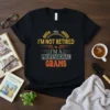 I'm Not Retired I'm A Professional Grams text design on a black t-shirt with yellow, orange, and grey typography