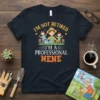 I'm Not Retired I'm A Professional Nene t-shirt with a graphic of a woman watering plants and two children