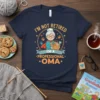I'm Not Retired I'm A Professional Oma T-Shirt design featuring a cartoon grandmother holding a basket filled with toys