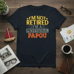 T-shirt with yellow and orange text that reads "I'm Not Retired I'm A Professional Papou" on a navy background