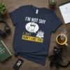 Navy t-shirt with "I'm Not Shy I Just Don't Like You" text and a cat wearing sunglasses in a speech
