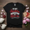 Black t-shirt with red and white text "I'm Not Spoiled My Husband Just Loves Me", featuring a kiss mark and
