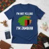 I'm Not Yelling I'm Zambian T-Shirt with Zambia flag graphic and eagle emblem. White text on navy blue shirt