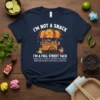 Navy t-shirt with "I'm Not A Snack I'm A Full Street Taco" text and a cute taco cart graphic