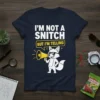 Navy t-shirt with white text "I'M NOT A SNITCH BUT I'M TELLING" above a cartoon fox holding a megaphone