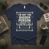 Navy t-shirt with white text: "I'm Not The Bigger Person I Suggest You Leave Me Alone," featuring lightning and cloud