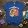 I'm Procrastinating t-shirt design with a sloth knitting in a chair under a rainbow