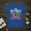 Retirement t-shirt with text "I'm Retired Every Hour Is A Happy Hour" and tropical graphics like palm trees and a