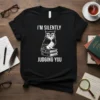 Black t-shirt with white text "I'm Silently Judging You" and a graphic of an owl sitting on books