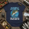 I'm So Good At Catching Fish That The Fish Tell Stories About Me humorous fishing quote on a navy t-shirt