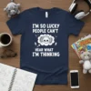 I'm So Lucky People Can't Hear What I'm Thinking quote on navy t-shirt with skull wearing headphones graphic
