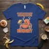 Funny t-shirt with text "I'm sorry for what I said when I was hungry" and cartoon stomach character holding a