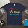Math joke t-shirt with "I'm sqrt(v) + tan²c and I know it" quote in red, yellow, and teal text on