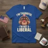 I'm Thankful I'm Not A Liberal text with a cool turkey wearing sunglasses and a patriotic hat on a blue