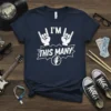 Navy t-shirt with white text "I'M THIS MANY" and rock on hand gestures, with a guitar headstock graphic