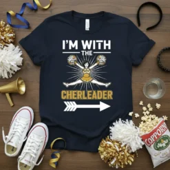 I'm With The Cheerleader text with a leaping cheerleader graphic and arrow on a navy t-shirt