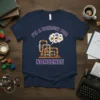 T-shirt with "I'm a Conduit for Nonsense" text and a cartoon pipe system graphic in a thought bubble