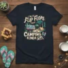 I'm a Flip Flops and Camping Kinda Girl text design with vintage camper, tent, and campfire graphic