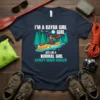 I'm a Kayak Girl Just Like a Normal Girl Except Much Cooler quote on a navy t-shirt with a graphic