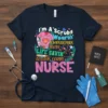 I'm A Scrubs Wearin' Temperature Takin' Life Savin' Always Carin' NURSE quote on a dark navy t-shirt with medical graphics