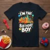 I'm The Birthday Boy t-shirt with cartoon hotdog, burgers, fries, and city skyline graphics