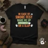 Black t-shirt with orange and green text that reads "In Case Of Snore Fest Wake Me Up with Coffee... Or