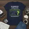 T-shirt featuring the text "In Chemistry A+B→C+D In Nuclear Engineering Any Questions?" with complex equations and a question mark graphic