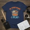 Christian drummer t-shirt with "In Jesus Name I Play" text, open bible, and drum set graphic