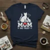 In Mom We Trust t-shirt design with white cats and heart graphic, featuring bold typography