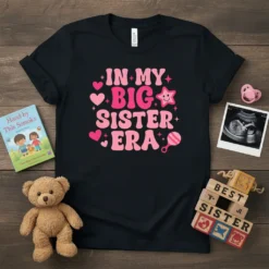 In My Big Sister Era text design with pink hearts and stars on a black t-shirt