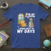 T-shirt design with text "In My Classroom I Spend Most Of My Days" featuring a cute owl on a stack